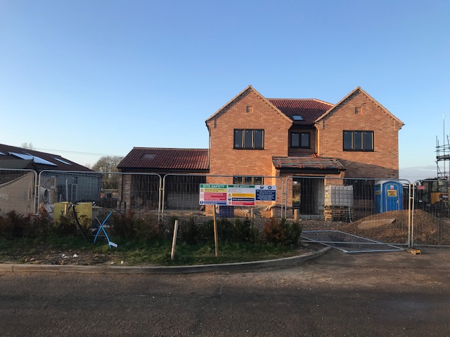 New house with new roof by roofers in Norwich