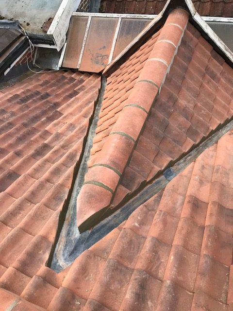 Lead valley run between two tiled roof slopes