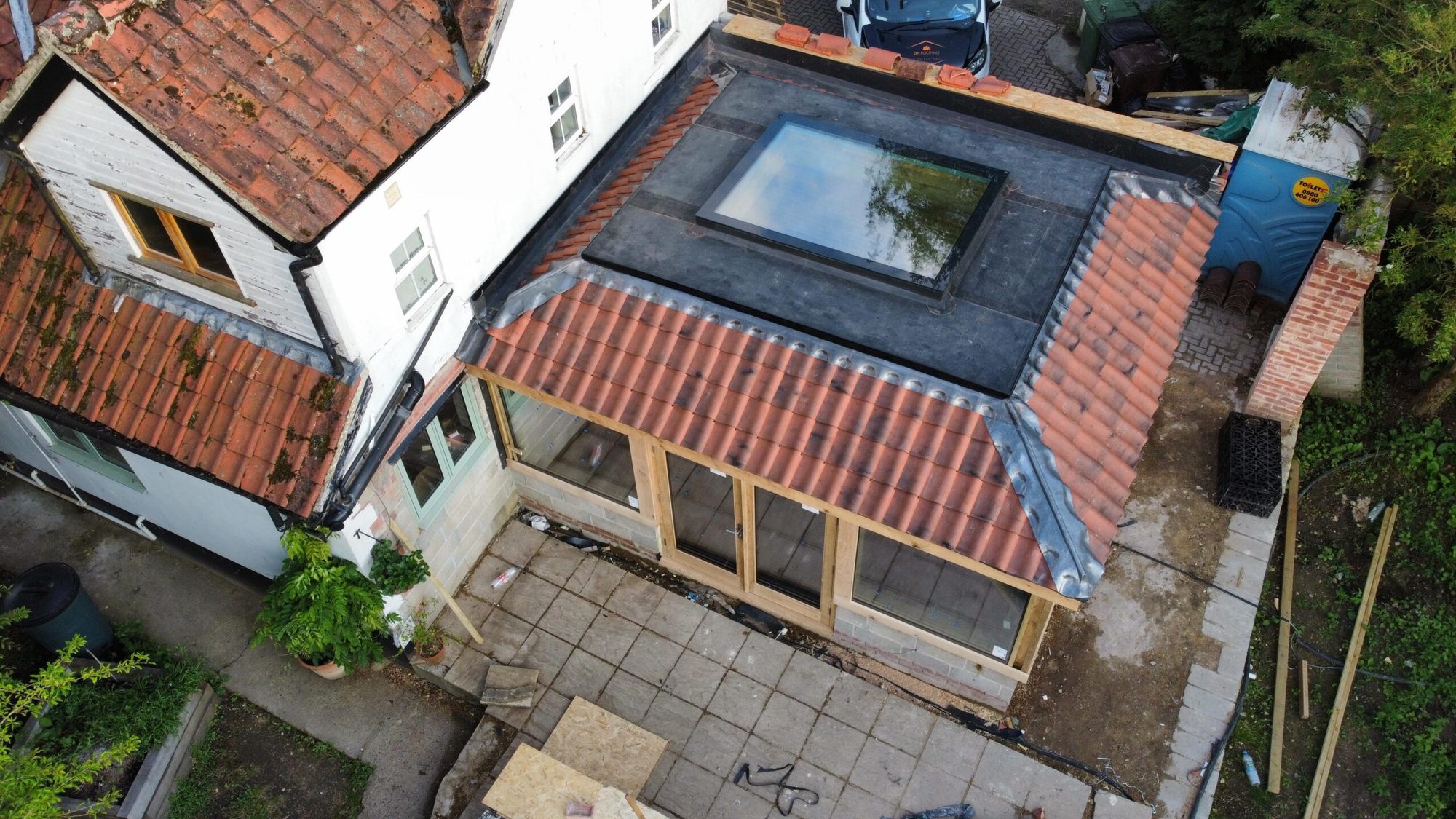 Aerial view of a house with a new extension roof and rooflight