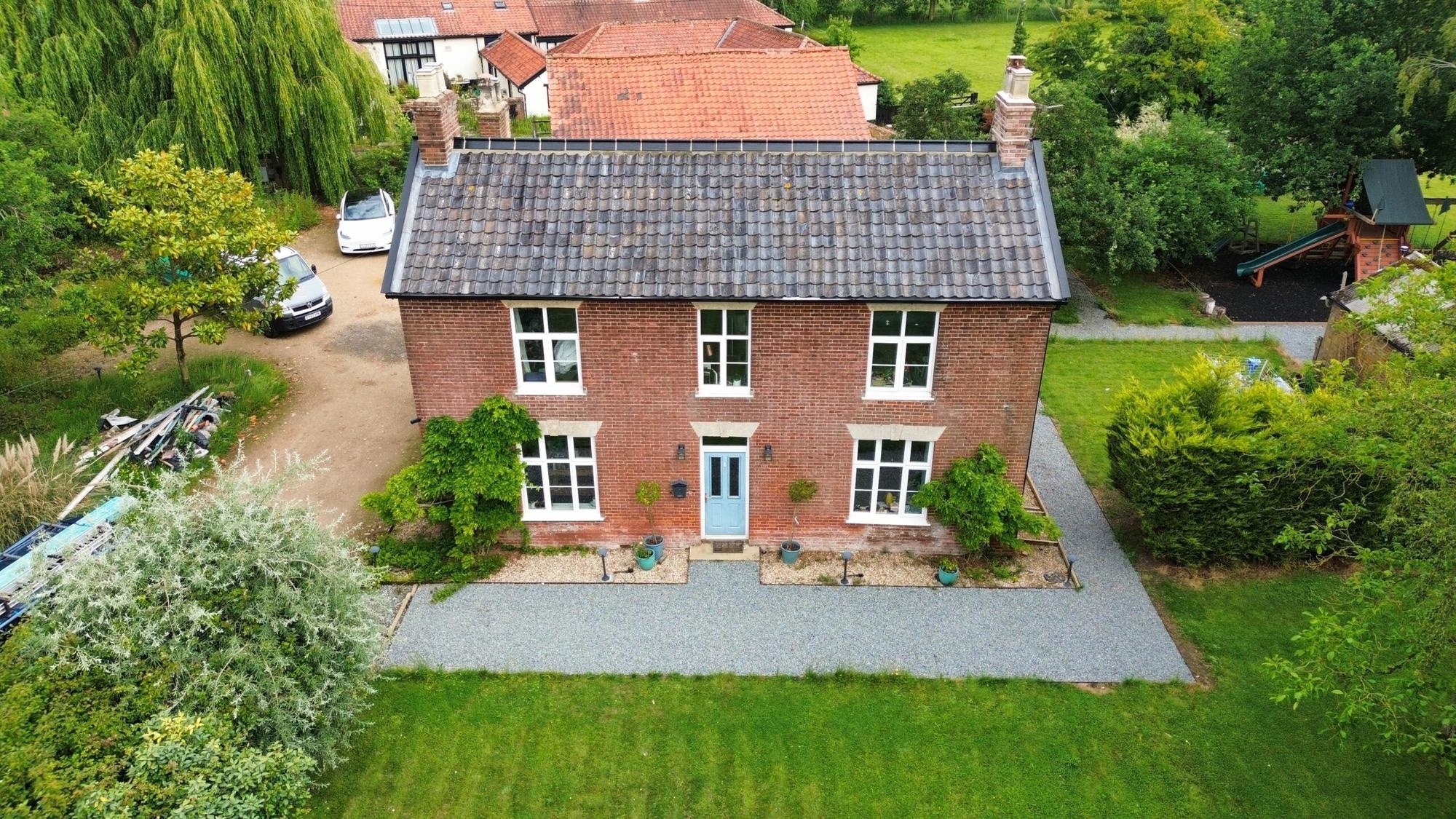 Brick house in Norfolk with a completed slate roof