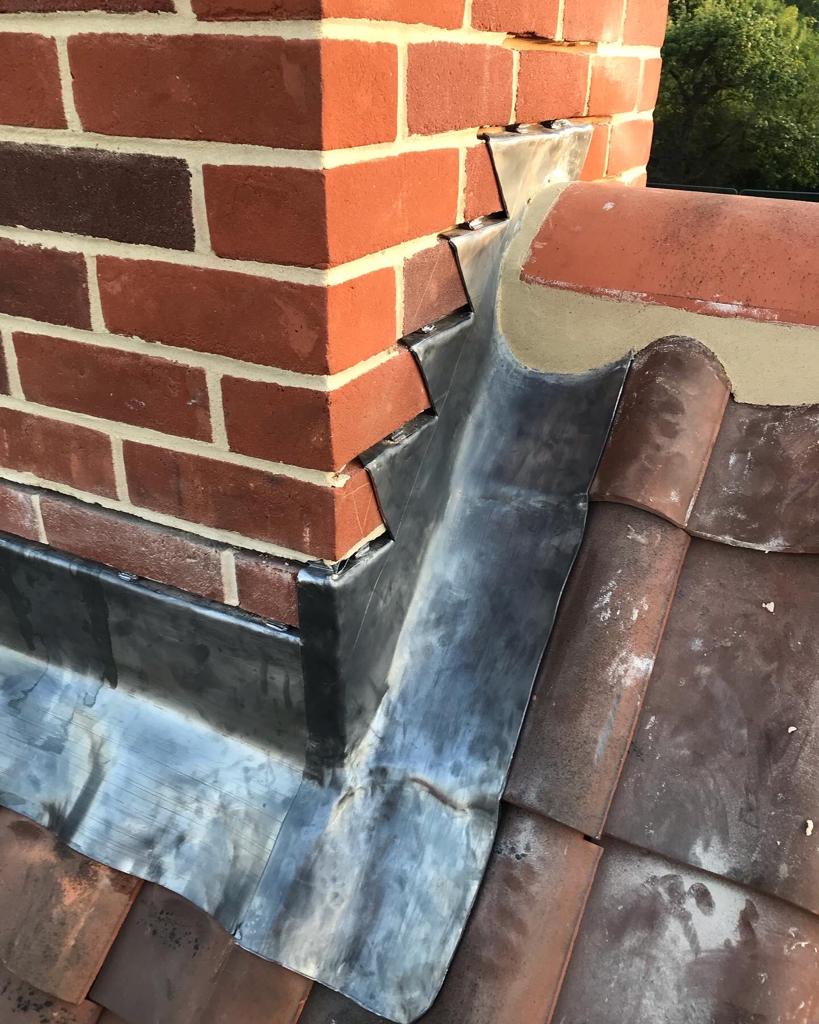 Lead valley and flashing on a tiled roof