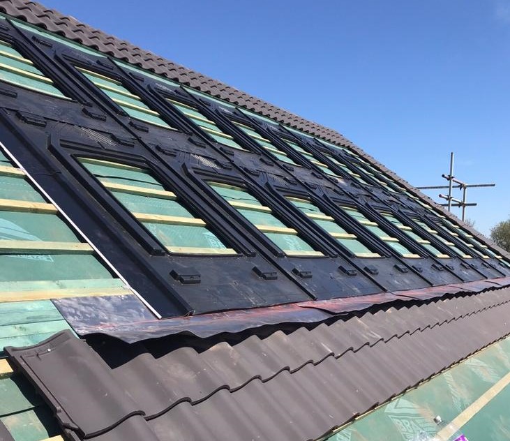Rooftop solar panels installed by DH Roofing Contractors