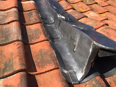 Lead flashing worked around a roof detail