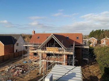 Pitched tiled roof against a blue sky