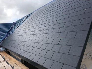 Slate roof tiles laid in courses